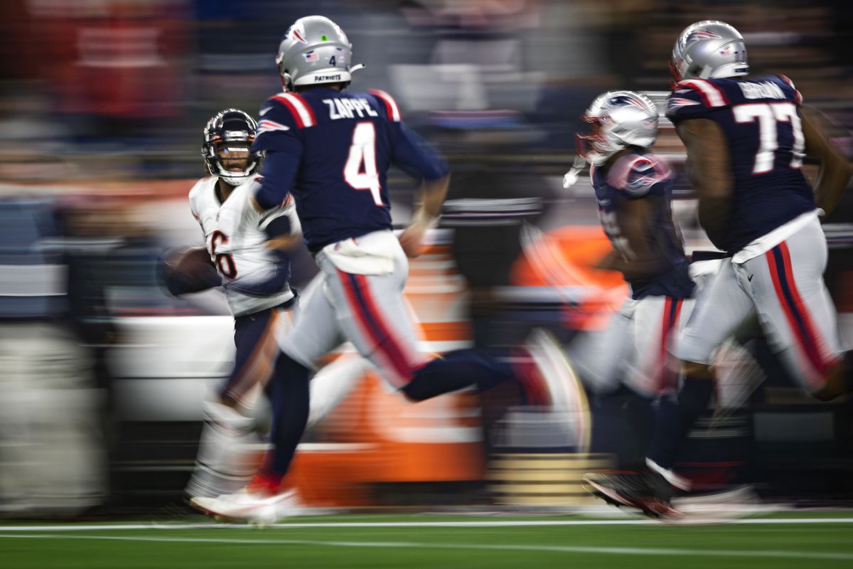 Kyler Gordon #6 of the Chicago Bears returns an interception as Bailey Zappe #4 of the New England Patriots pursues during the fourth quarter of an NFL football game at Gillette Stadium on October 24, 2022 in Foxborough, Massachusetts.