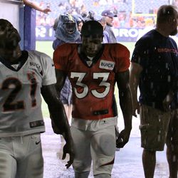 Broncos RB Ronnie Hillman and safety Duke Ihenacho come back down the tunnel after inspecting the rain situation