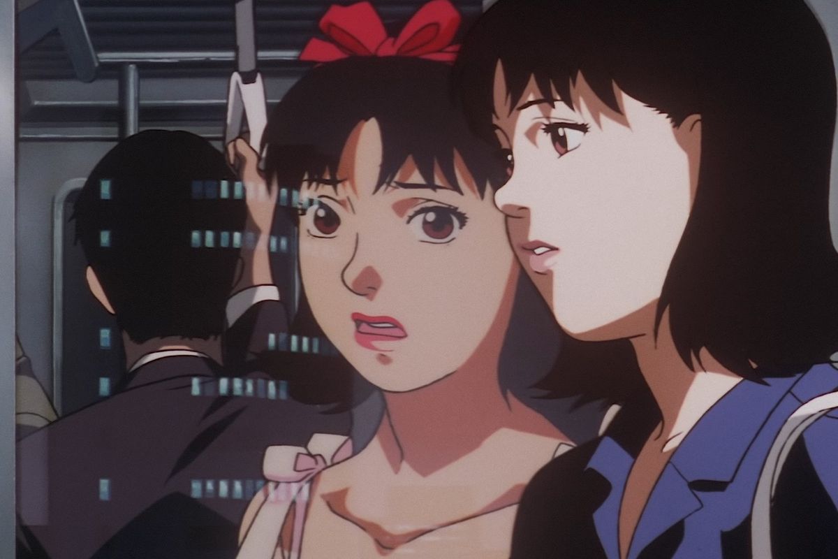 Mima on a train in the anime film Perfect Blue, gasping over her own reflection