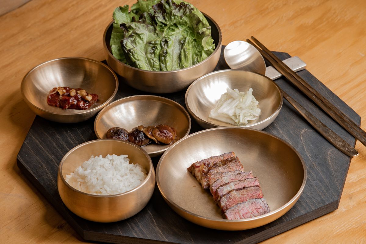 Dishes of braised beef short rib, walnut ssamjang, rice, and lettuce leaves, from Suragan, a new restaurant in San Francisco.