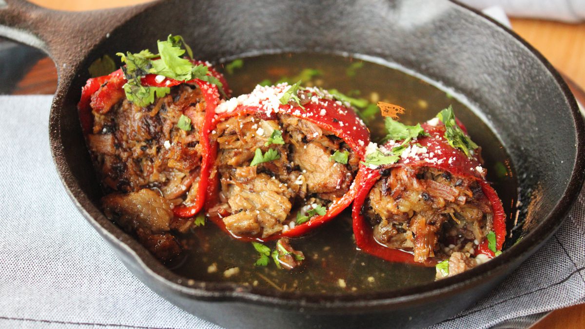 Barbecue stuffed peppers in a cast iron skillet
