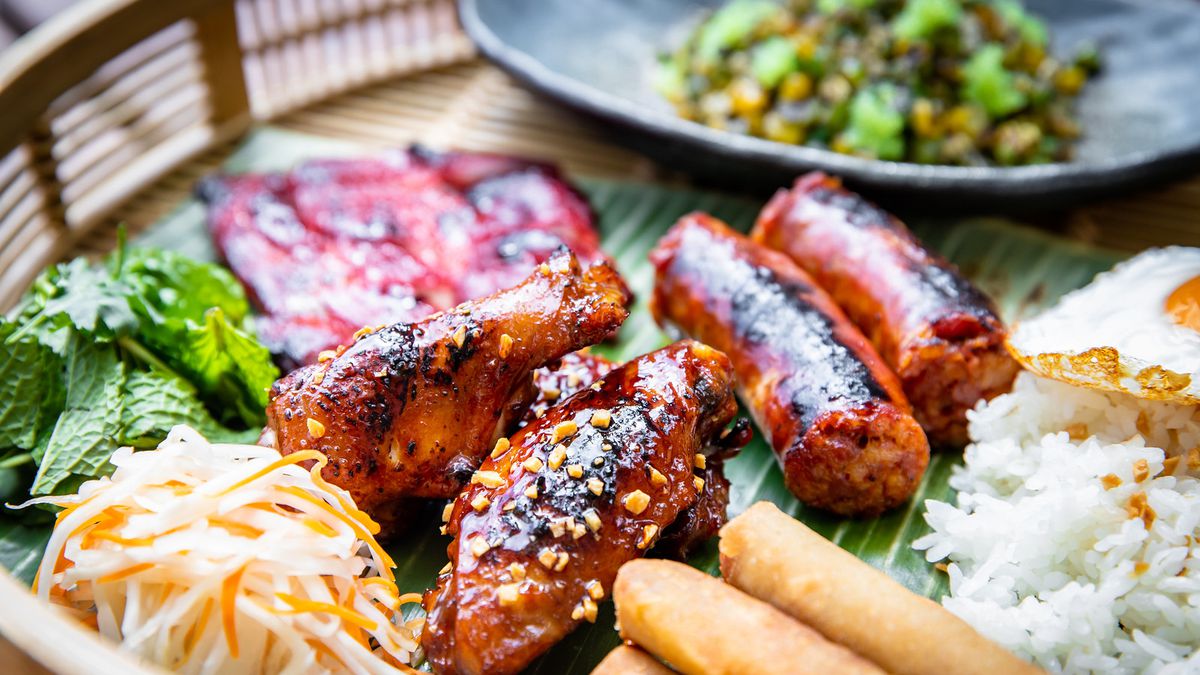 A tray with chicken wings, tocino, loganiza, and lumpia Shanghai.