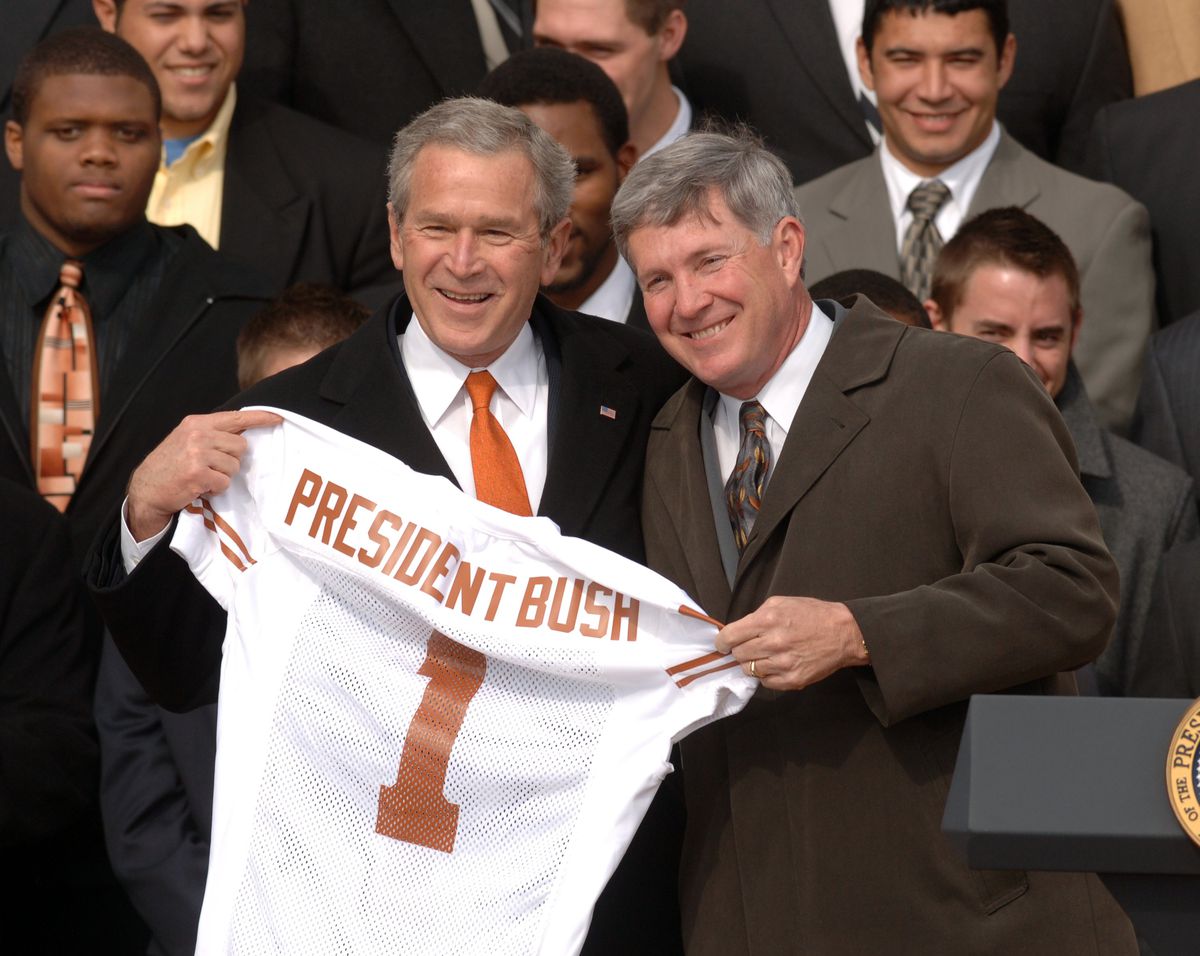 President George W. Bush receives a jersey from Texas Longho