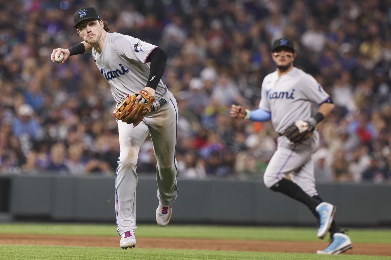 Miami Marlins third baseman Brian Anderson (15) throws tor retire Colorado Rockies shortstop Trevor Story (not pictured) in the sixth inning at Coors Field