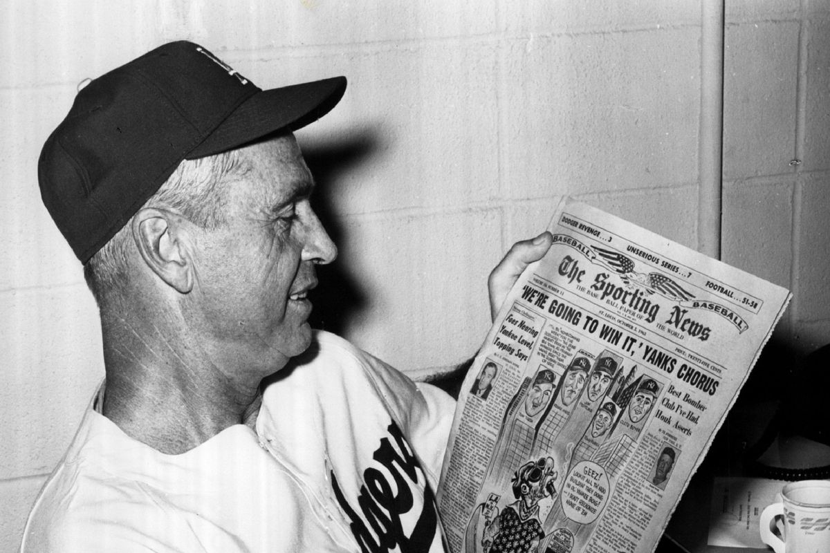 Dodgers manager Walt Alston looks at The Sporting News ahead of the 1963 World Series, in which the Yankees boasted they would win the series.