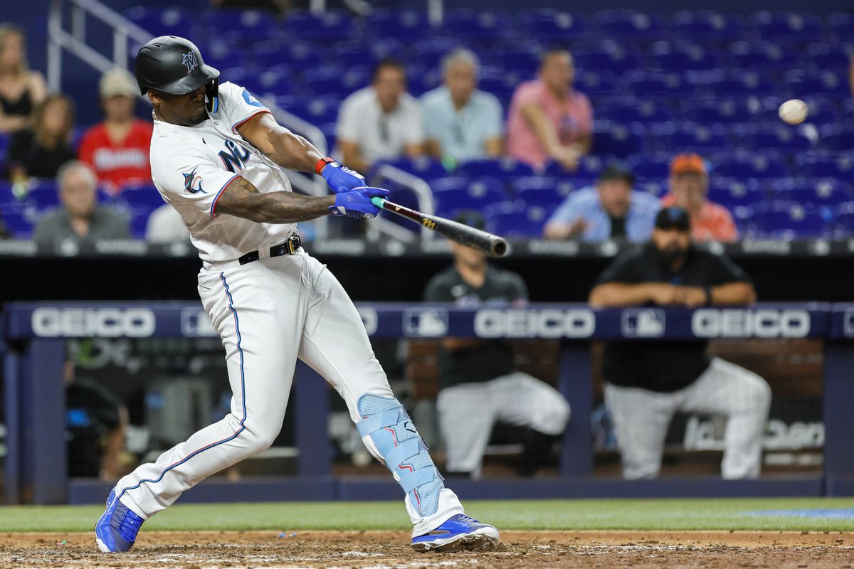 Miami Marlins designated hitter Jorge Soler (12) hits a two-run home run against the Washington Nationals during the ninth inning at loanDepot Park.