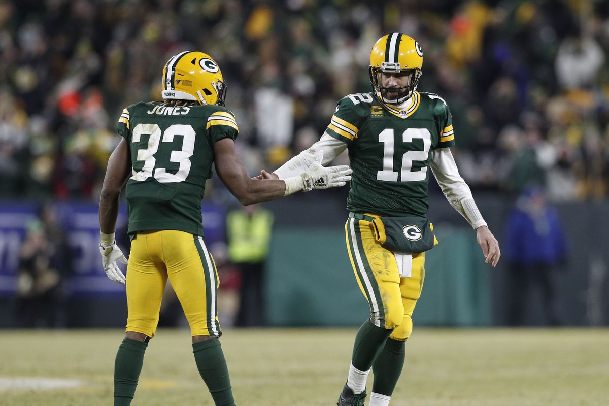 Green Bay Packers quarterback Aaron Rodgers and running back Aaron Jones celebrate a touchdown against the Seattle Seahawks in the third quarter of a NFC Divisional Round playoff football game at Lambeau Field.&nbsp;