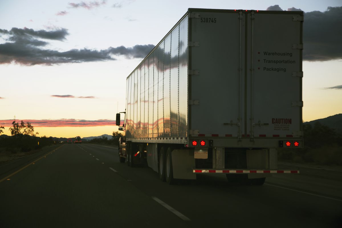 An 18-wheeler semi-truck drives west on Interstate 10, near Palm Springs, California