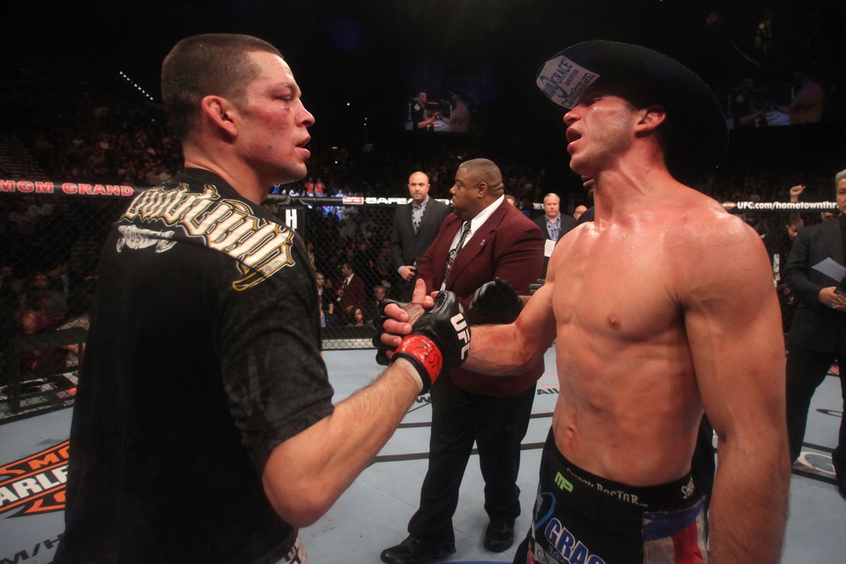 Nate Diaz (left) and Donald Cerrone (right) make up after their thrilling fight at UFC 141 last night (Fri., Dec. 30, 2011) in Las Vegas, Nevada. Photo by Donald Miralle/Zuffa LLC/Zuffa LLC via Getty Images. 