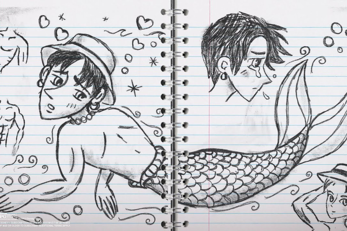 Turning Red - a shot of Mei’s notebook in Turning Red, showing anime mermaid boys with abs