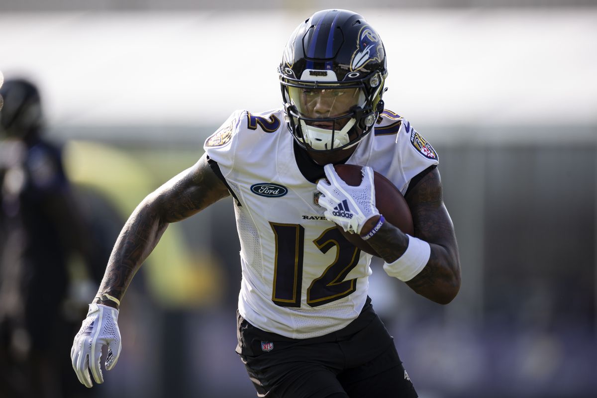 Rashod Bateman #12 of the Baltimore Ravens in action during training camp at Under Armour Performance Center Baltimore Ravens on July 28, 2021 in Owings Mills, Maryland.