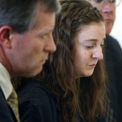 Toni Fratto tears up after reading her confession in 4th District Judicial Court in Elko, Nev., Friday Jan. 27, 2012. Fratto, with her attorneys John Springgate, left, and David Lockie, right, pleaded guilty to a reduced charge of second-degree murder in the death of fellow West Wendover High School classmate Micaela Costanzo.