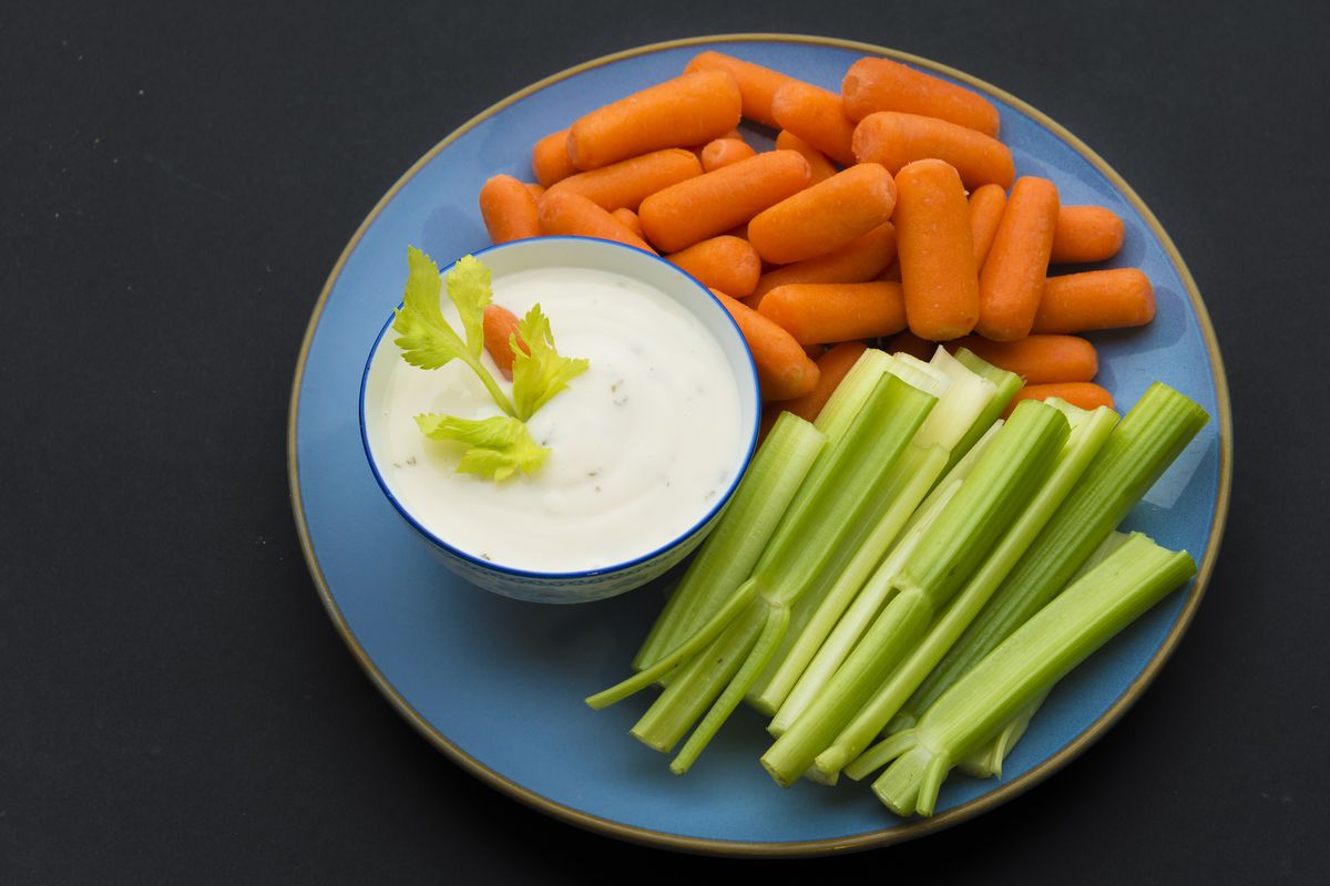 Baby carrots, celery sticks and a bowl full of delicious...