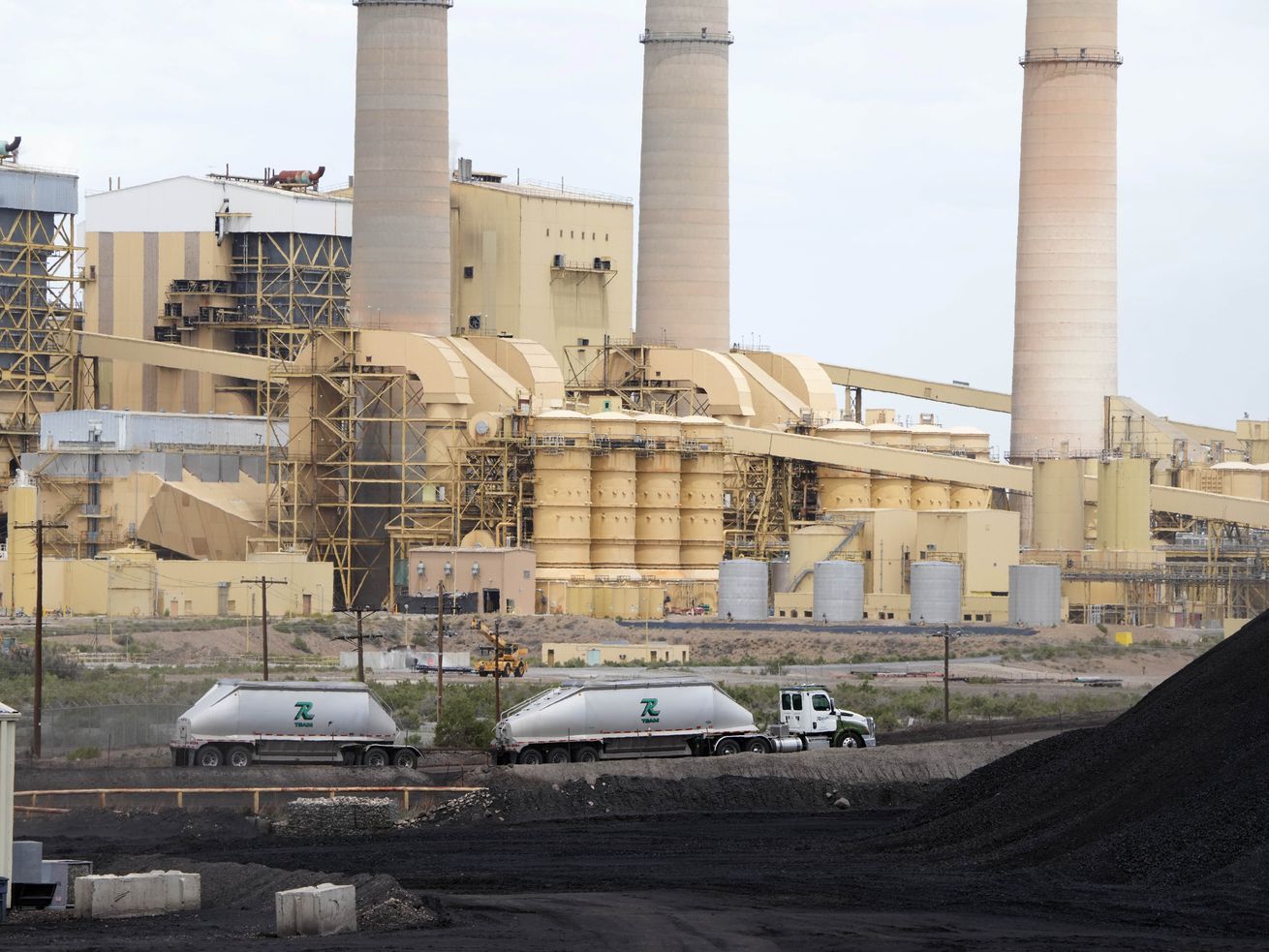 A truck delivers a load of coal to the PacifiCorp Hunter coal-fired electrical generation plant in Castle Dale, Utah, on June 13.