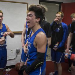 Pleasant Grove's Kawika Akina celebrates with teammates following Pleasant Grove Vikings' 57-42 victory against the Copper Hills Grizzlies in the Class 6A state semifinals at the Jon M. Huntsman Center in Salt Lake City on Friday, March 2, 2018.