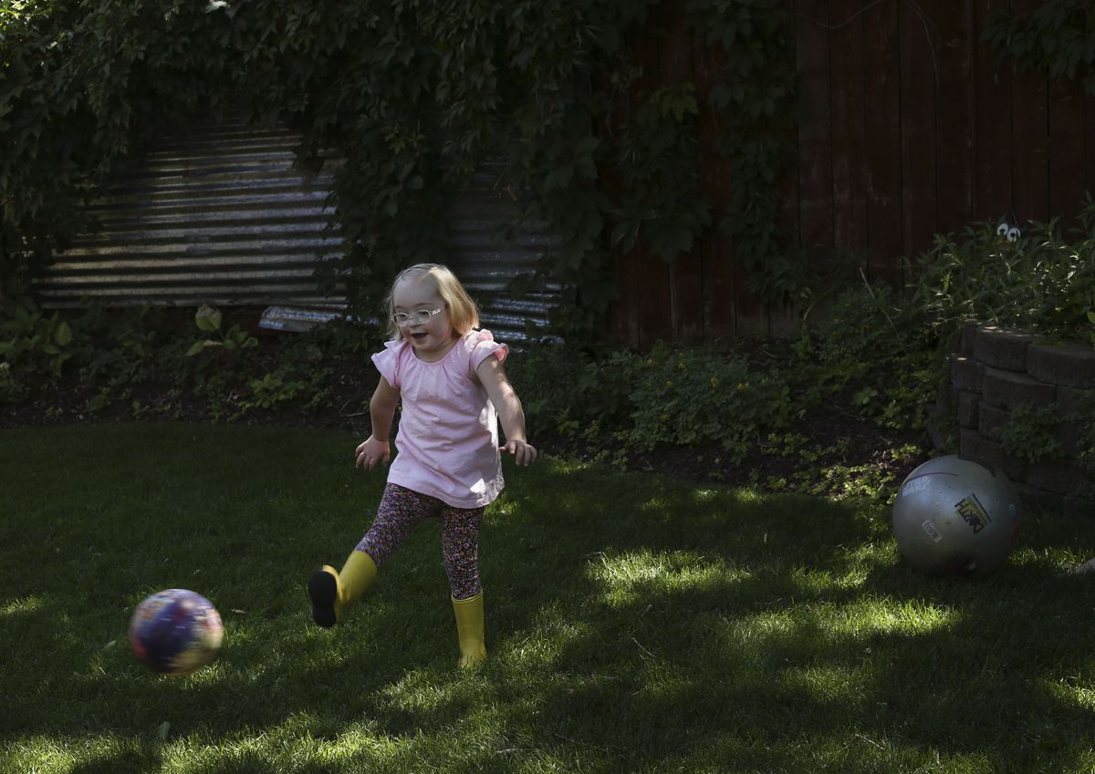 Tori Longwell, who will be a first grader at Highland Park Elementary School, plays kickball at her home in Salt Lake City on Wednesday, July 29, 2020. The Longwells have decided as a family to return to remote learning this fall due to risks to Tori, who has Down syndrome, but also to the rest of the family.