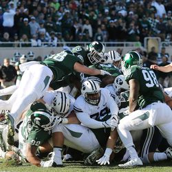 Brigham Young Cougars are held on a fourth down near the goal line by the Michigan State Spartans  in East Lansing, MI on Saturday, Oct. 8, 2016.