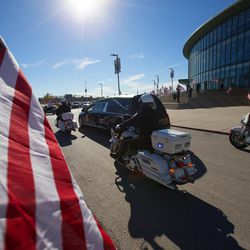 The hearse is escorted from the Maverik Center in West Valley City following funeral services for West Valley police officer Cody Brotherson on Monday, Nov. 14, 2016.