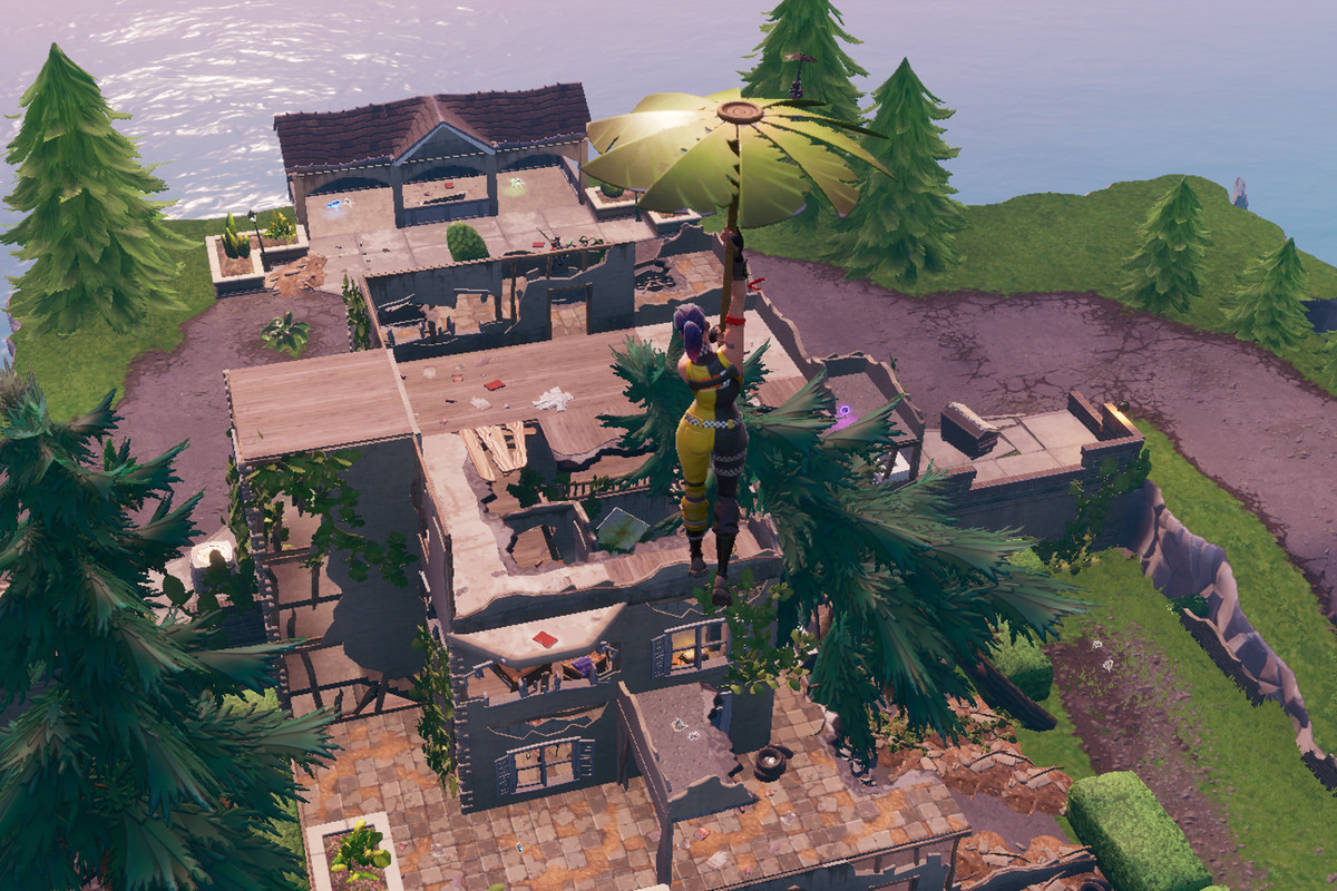 A Fortnite player landing at the Hero Mansion 