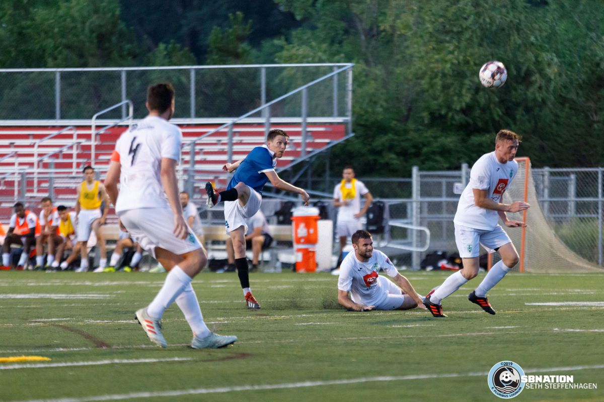 July 16, 2019 - St. Louis Park, Minnesota, United States - Minneapolis City SC midfielder Nick Hutton (14) scores a goal off a deflected shot during the NPSL North playoff match against Med City FC at Benilde-St. Margaret's. 
