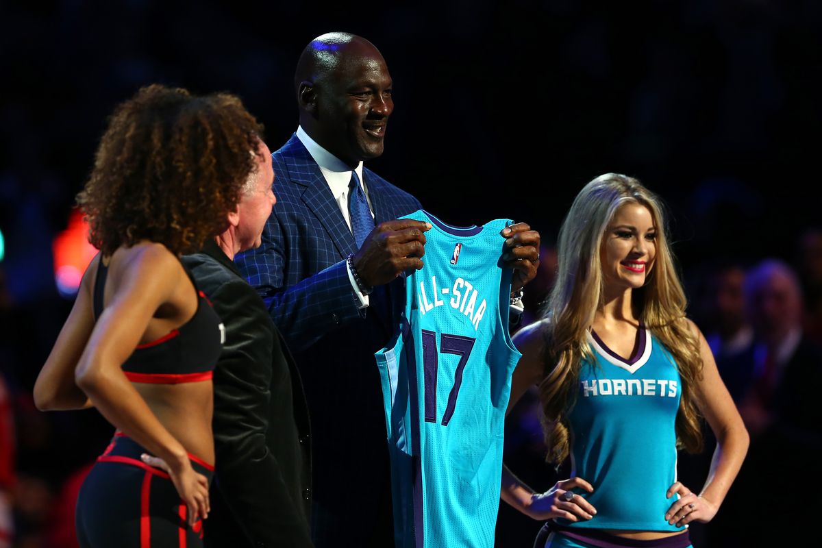 Charlotte Hornets owner Michael Jordan with a 2017 All-Star jersey.
