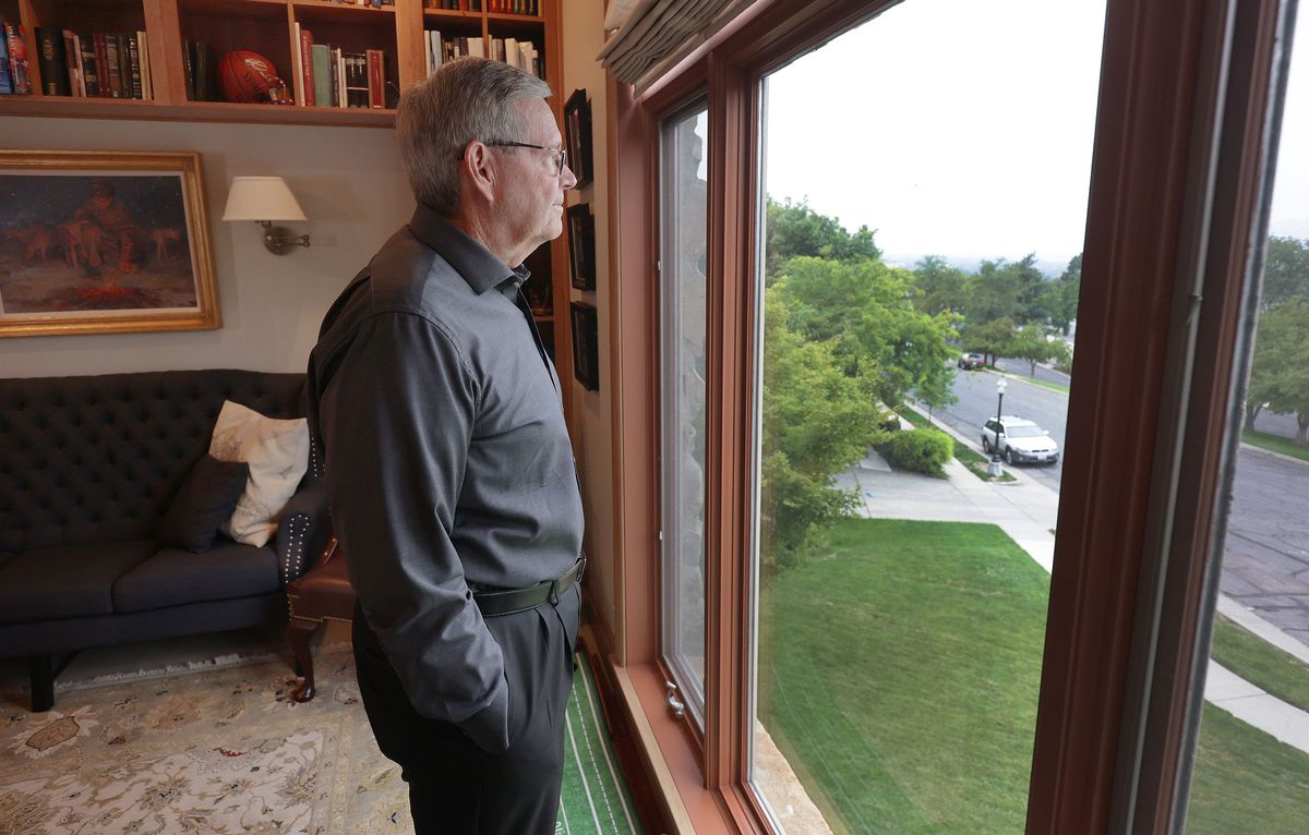 Former Utah Gov. Mike Leavitt looks out of the window at his home in Salt Lake City on Wednesday, Sept. 1, 2021.