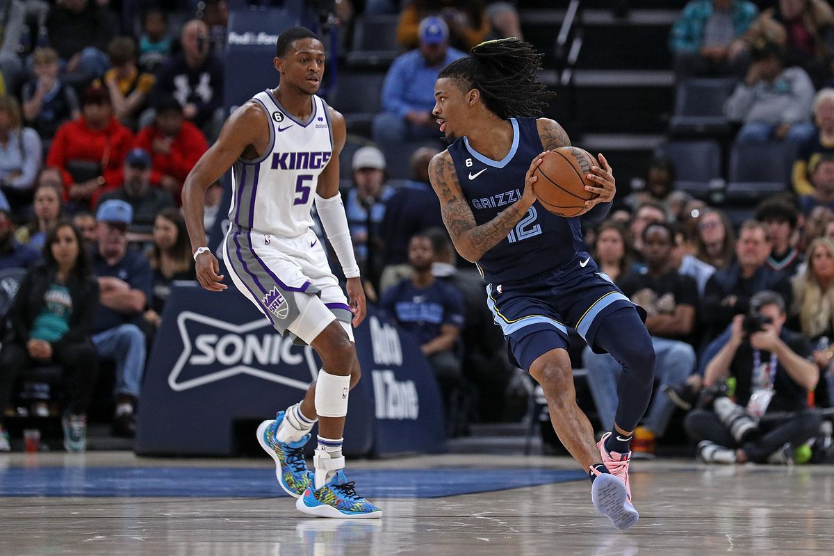 MEMPHIS, TENNESSEE - JANUARY 01: Ja Morant #12 of the Memphis Grizzlies handles the ball during the game against the Sacramento Kings at FedExForum on January 01, 2023 in Memphis, Tennessee. NOTE TO USER: User expressly acknowledges and agrees that, by downloading and or using this photograph, User is consenting to the terms and conditions of the Getty Images License Agreement.