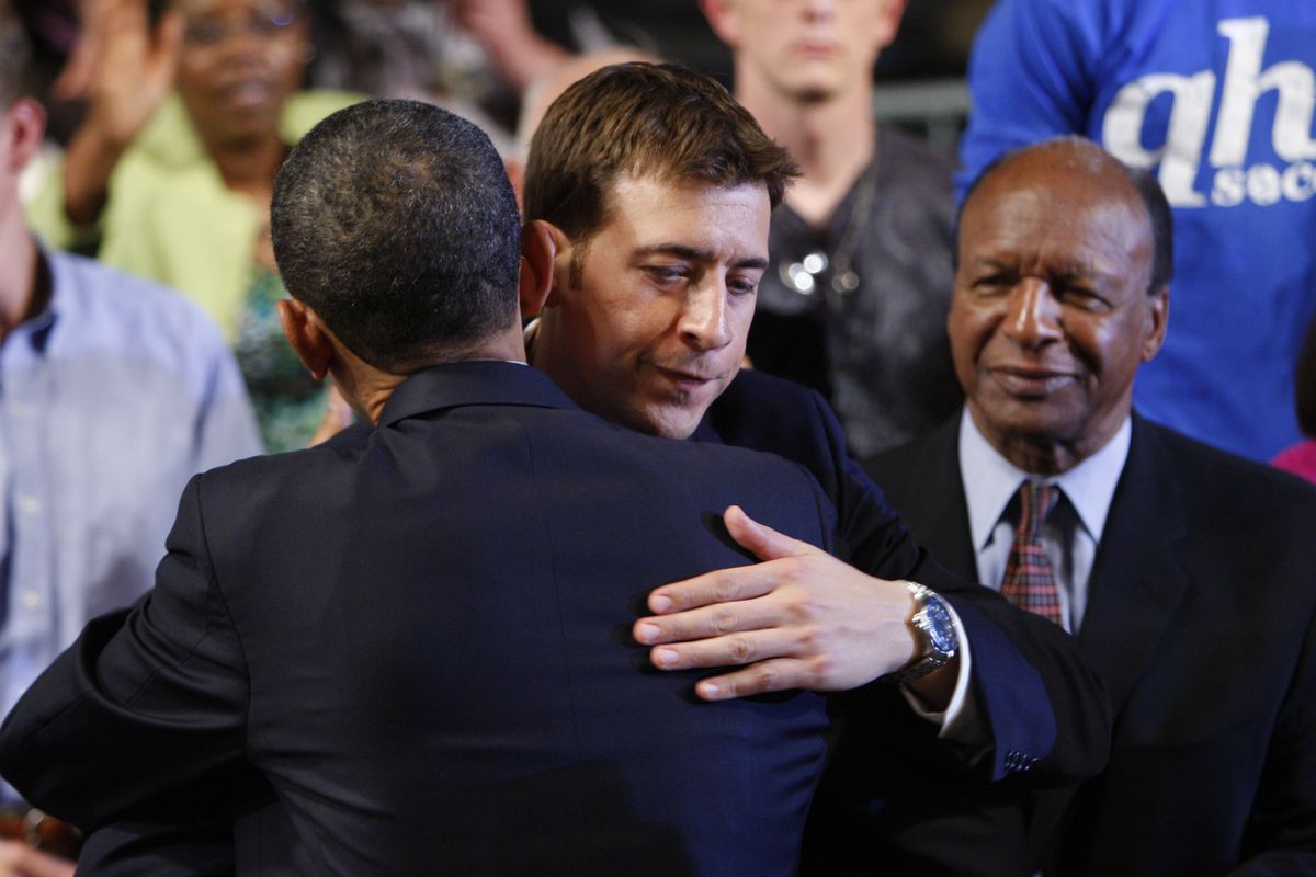 Then President Barack Obama, left, hugs then Illinois State Treasurer Alexi Giannoulias, center, after Obama gave a speech in downstate Quincy in 2010. Watching on the right is Illinois Secretary of State Jesse White. 