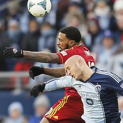 Real's Robbie Findley and Kansas City's Aurelien Collin battle for the ball as Real Salt Lake and Sporting KC play Saturday, Dec. 7, 2013 in MLS Cup action.