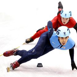 Apolo Anton Ohno of the United States leads Liang Wenhao of China in the Short Track Speed Skating Men's 1,000 m on day 6 of the Vancouver 2010 Winter Olympics.
