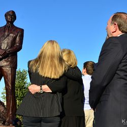 Gary Bettman and members of the Snider family looking at the unveiled Ed Snider statue