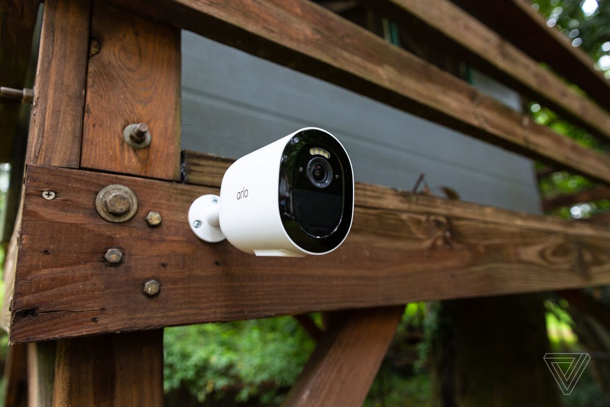 Image of an Arlo security camera mounted on a tree house.