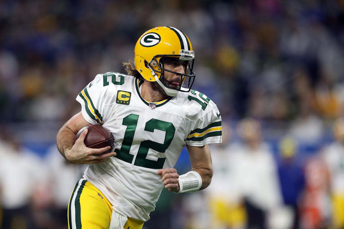 Aaron Rodgers #12 of the Green Bay Packers carries the ball against the Detroit Lions during the first quarter at Ford Field on January 09, 2022 in Detroit, Michigan.