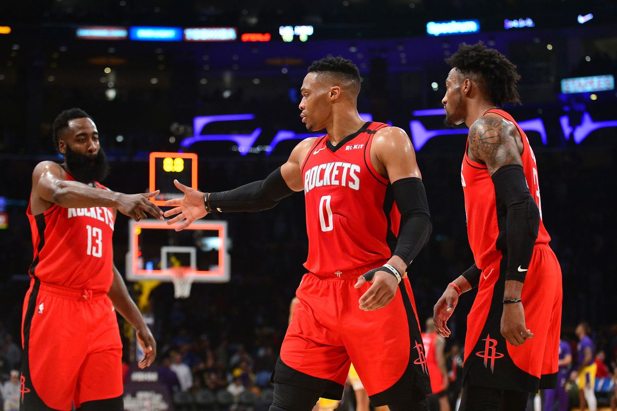 Houston Rockets guard James Harden guard Russell Westbrook and forward Robert Covington celebrate the 121-111 victory against the Los Angeles Lakers at Staples Center.
