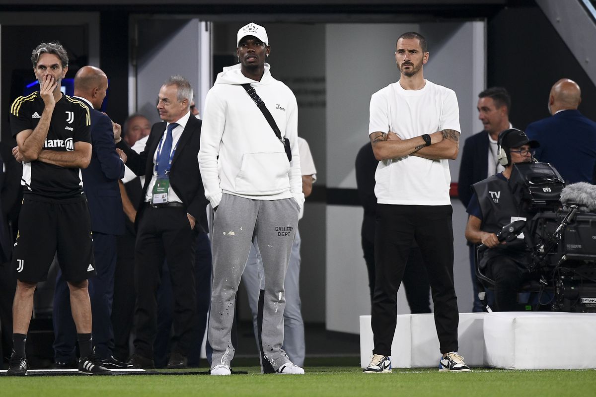 Paul Pogba (L) and Leonardo Bonucci (R) of Juventus FC look...