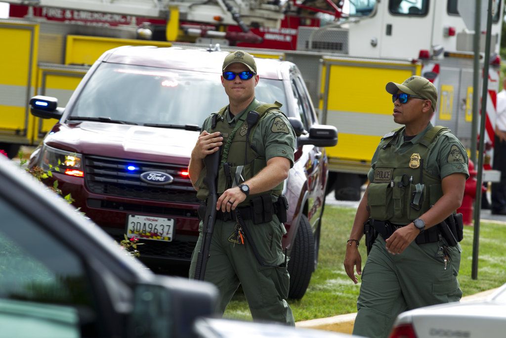 Maryland police officers patrol the area after multiple people were shot at at The Capital Gazette newspaper in Annapolis, Md., Thursday, June 28, 2018. | AP Photo
