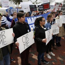 People participate in a "March For Our Lives" event Saturday, March 24, 2018, in Norfolk, Va. Students and activists across the country planned events Saturday in conjunction with a Washington march spearheaded by teens from Marjory Stoneman Douglas High School in Parkland, Fla., where over a dozen people were killed in February. (Stephen M. Katz/The Virginian-Pilot via AP)