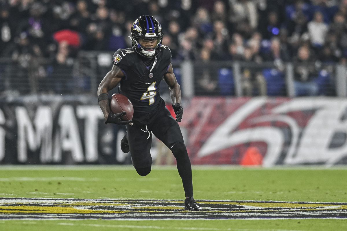 Baltimore Ravens wide receiver Zay Flowers (4) runs after a first half catch against the Cincinnati Bengals at M&amp;T Bank Stadium.
