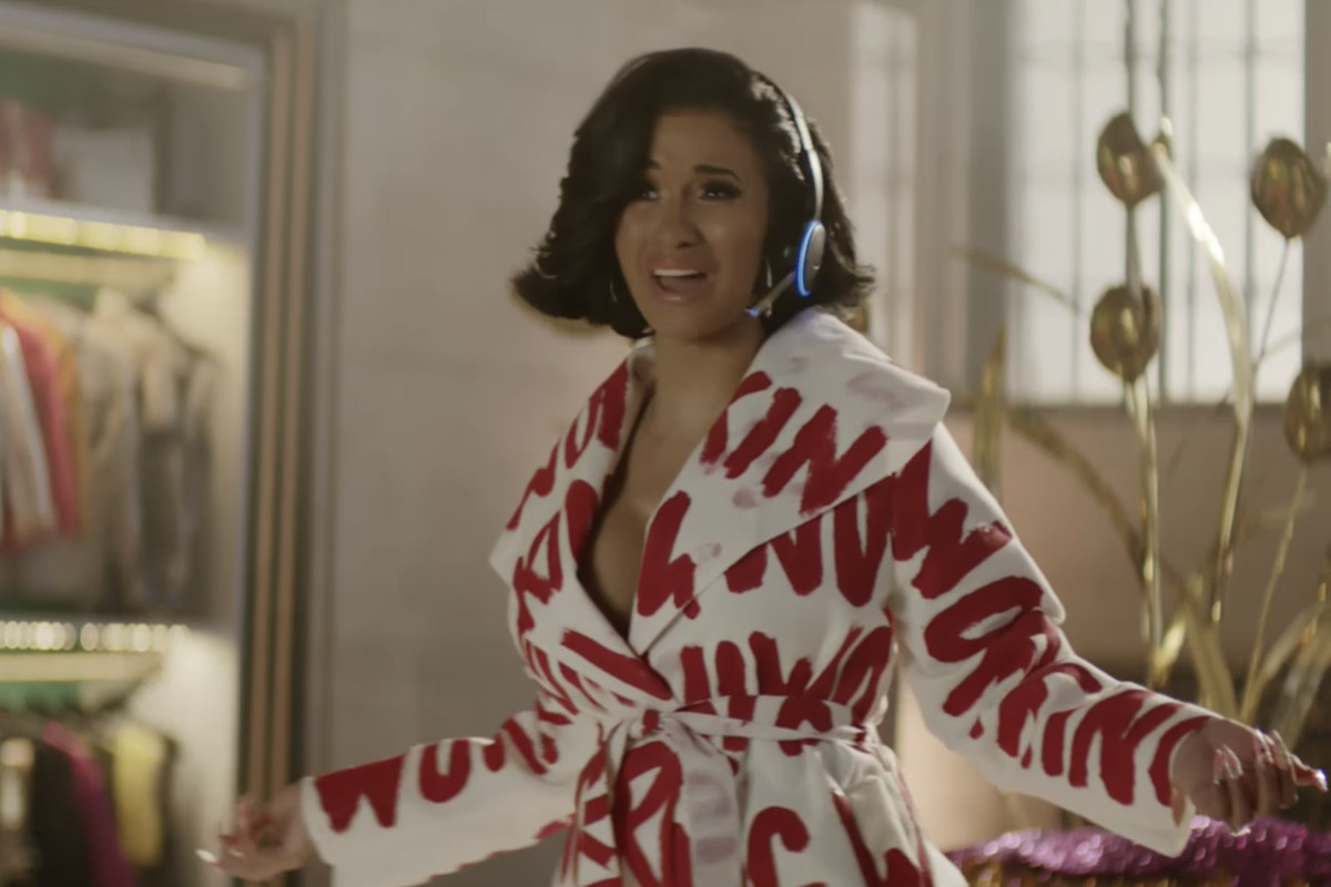 Singer Cardi B wears a headset and microphone to act as Amazon’s voice assistant, Alexa.