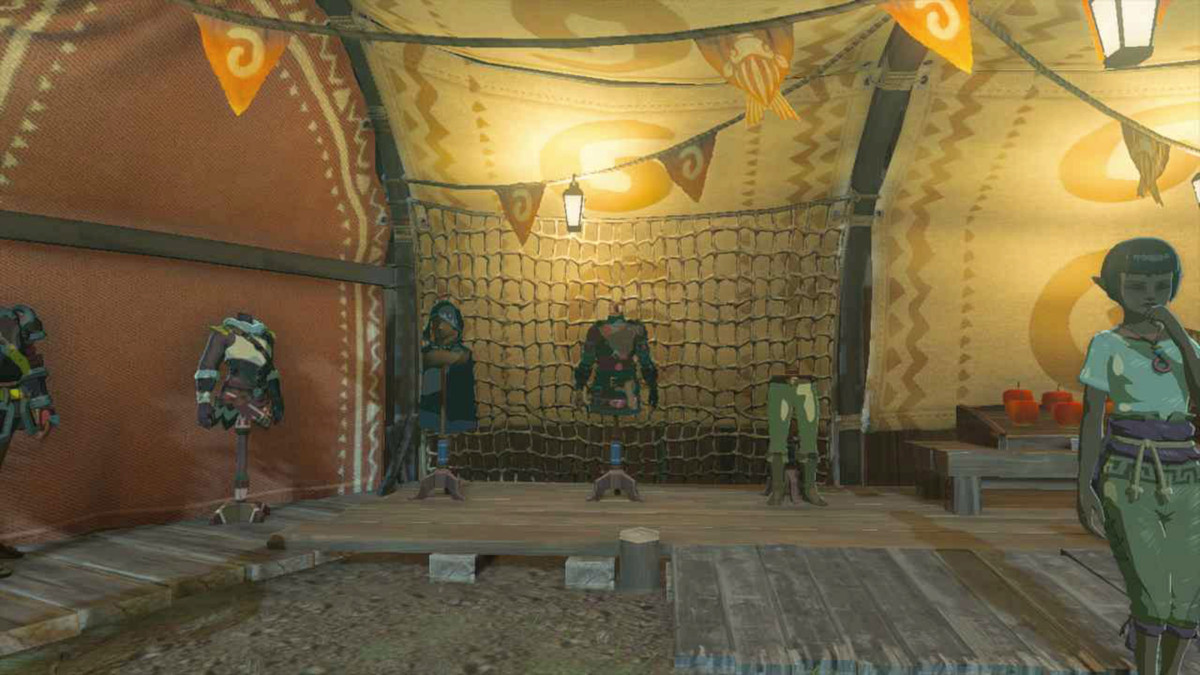 An image of the Hylian Armor set in The Legend of Zelda: Tears of the Kingdom.  The clothes are sitting on mannequins in an open market square stall. 