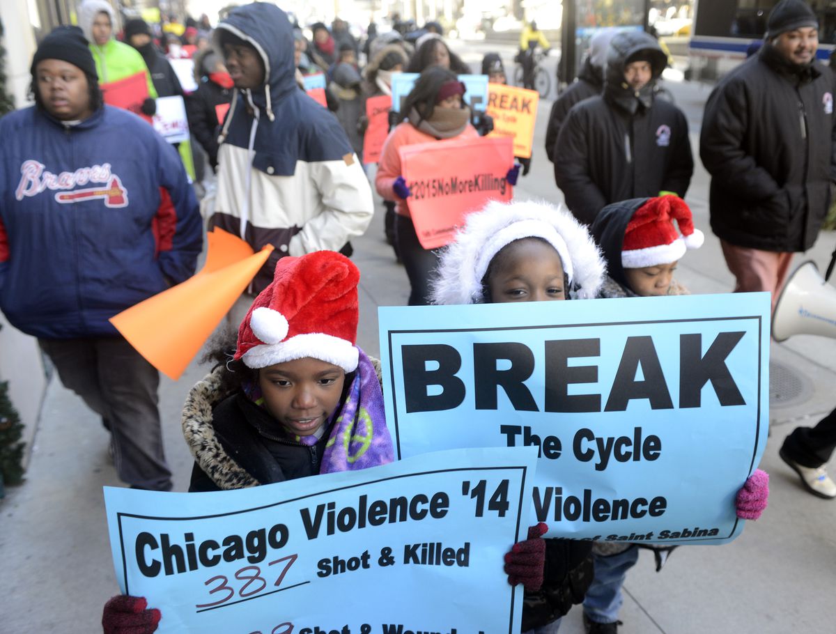 <small><strong>Princess, 8, (left) and Courtney, 9, were among those marching on Michigan Avenue Wednesday afternoon with members of Saint Sabina Church. | Michael Schmidt/Sun-Times </strong></small>