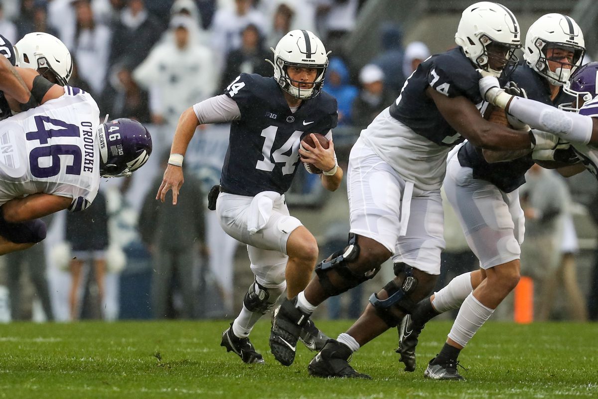 Oct 1, 2022; University Park, Pennsylvania, USA; Penn State Nittany Lions quarterback Sean Clifford (14) runs with the ball during the first quarter against the Northwestern Wildcats at Beaver Stadium.