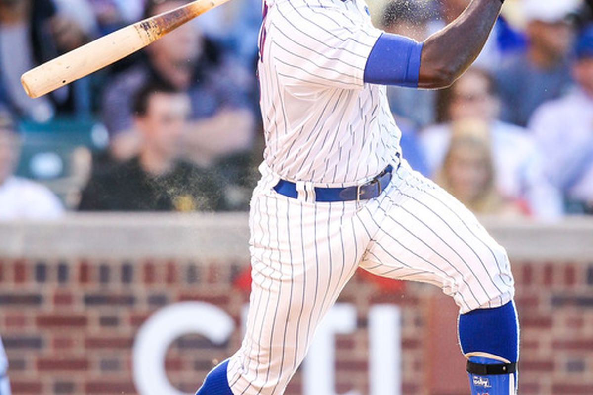 June 25, 2012; Chicago, IL, USA; Chicago Cubs left fielder Alfonso Soriano (12) hits a single in the first inning against the New York Mets at Wrigley Field. Mandatory Credit: Daniel Shirey-US PRESSWIRE