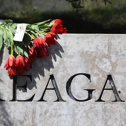 Flowers sit atop the sign at the entrance to the Ronald Reagan Presidential Library, Sunday, March 6, 2016, in Simi Valley, Calif. Former first lady Nancy Reagan died today at 94. 