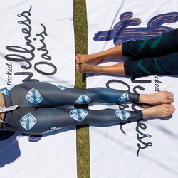 Mariah Perkins and How You Glow's Tara Sowalty modeling our custom towels.