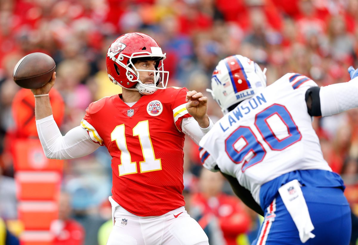 KANSAS CITY, MO - NOVEMBER 26:  Quarterback Alex Smith #11 of the Kansas City Chiefs passes as defensive end Shaq Lawson #90 of the Buffalo Bills defends during the game at Arrowhead Stadium on November 26, 2017 in Kansas City, Missouri.  (Photo by Jamie Squire/Getty Images)