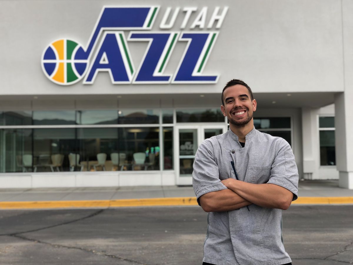 Utah Jazz chef Anthony Zamora poses outside of the team’s practice facility, Zions Bank Basketball Campus.