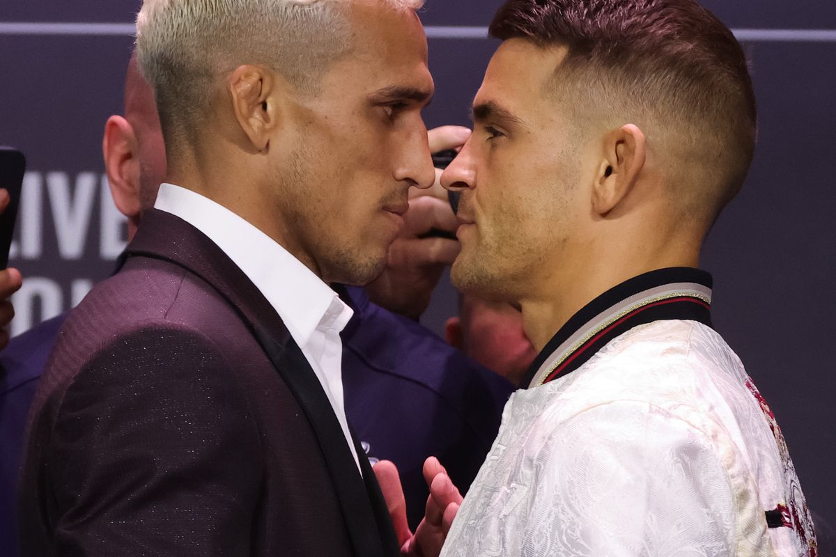 Charles Oliveira of Brazil and Dustin Poirier face off during the UFC 269 press conference at MGM Grand Garden Arena on December 09, 2021 in Las Vegas, Nevada.