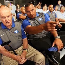 Former head coach LaVell Edwards and current head coach Kaliani Sitake watch a reunion segment being filmed on the 1996 Cotton Bowl champion football team during BYU Media Day at BYU Broadcasting in Provo on Thursday, June 30, 2016.