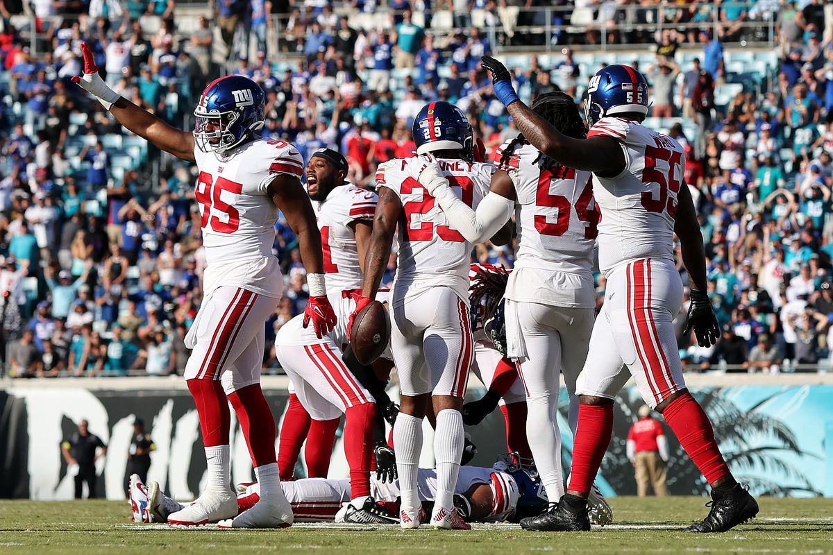 The New York Giants’ defense celebrates after a stop in the fourth quarter against the Jacksonville Jaguars at TIAA Bank Field on October 23, 2022 in Jacksonville, Florida.